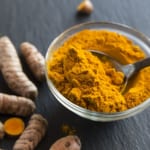 glass-bowl-of-curcuma-powder-and-fresh-organic-royalty-free-image-1579143652