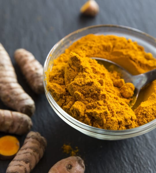 glass-bowl-of-curcuma-powder-and-fresh-organic-royalty-free-image-1579143652